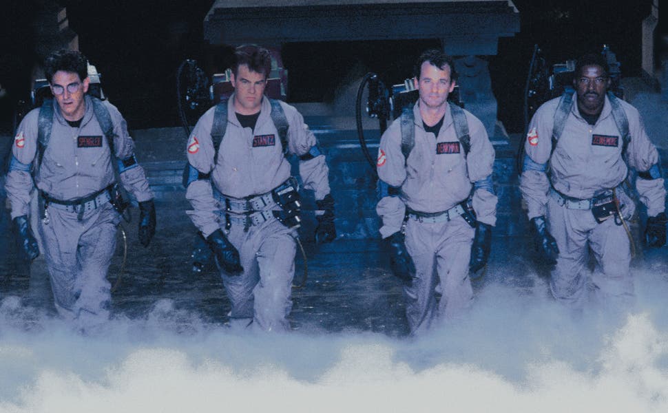 All four members of the original Ghostbusters crew, on their way to a job.
