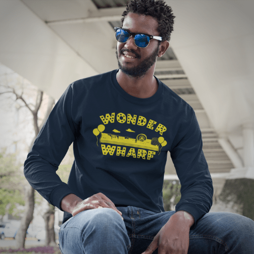 man wearing long sleeve wonder wharf shirt with caption Long Sleeve