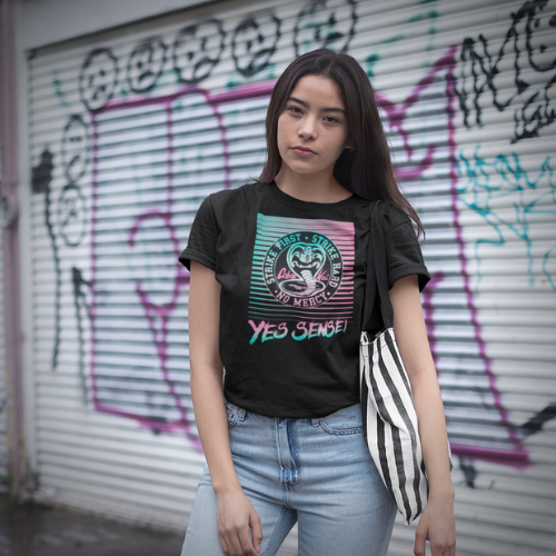 Woman wearing black Cobra Kai t-shirt with caption