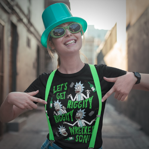 Woman wearing leprechaun hat, green suspenders and black t-shirt featuring Rick from Rick and Morty and the quote